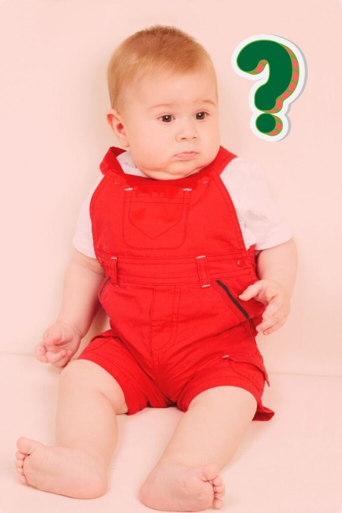 2024-12-27_BabyQ Baby in red overalls with bemused expression and large green question mark graphic near head
